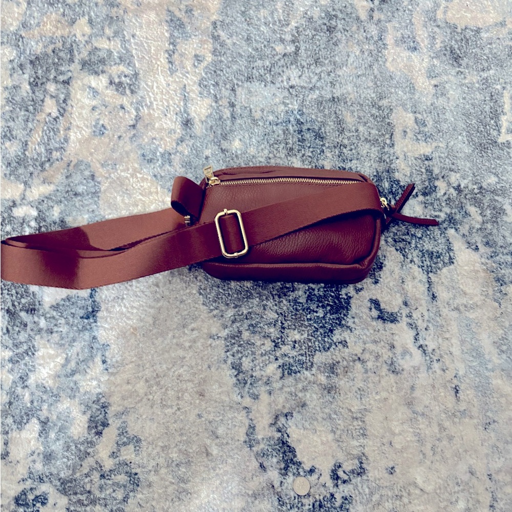 This is a new crossbody /belt bag  color is like Carmell brown
